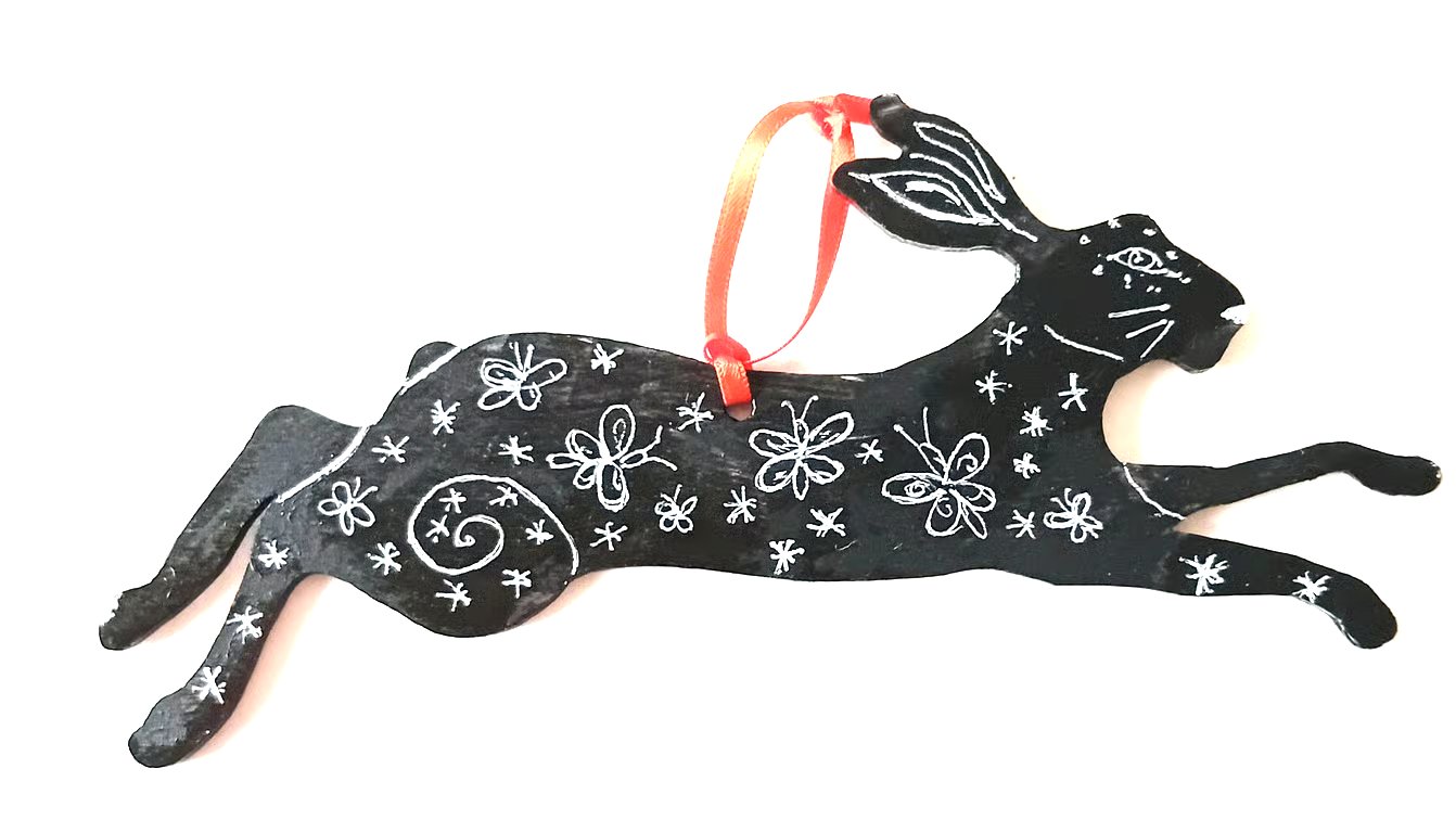 Hare with butterflies on wood
