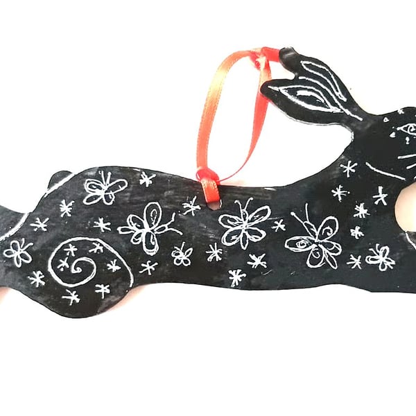Hare with butterflies on wood
