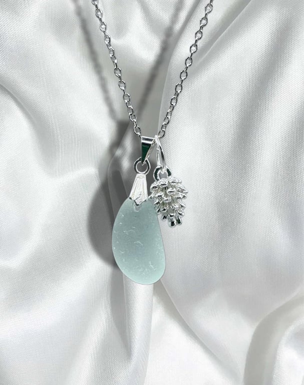 Sea glass necklace, Aqua  blue in colour, silver plated pine cone charm. 