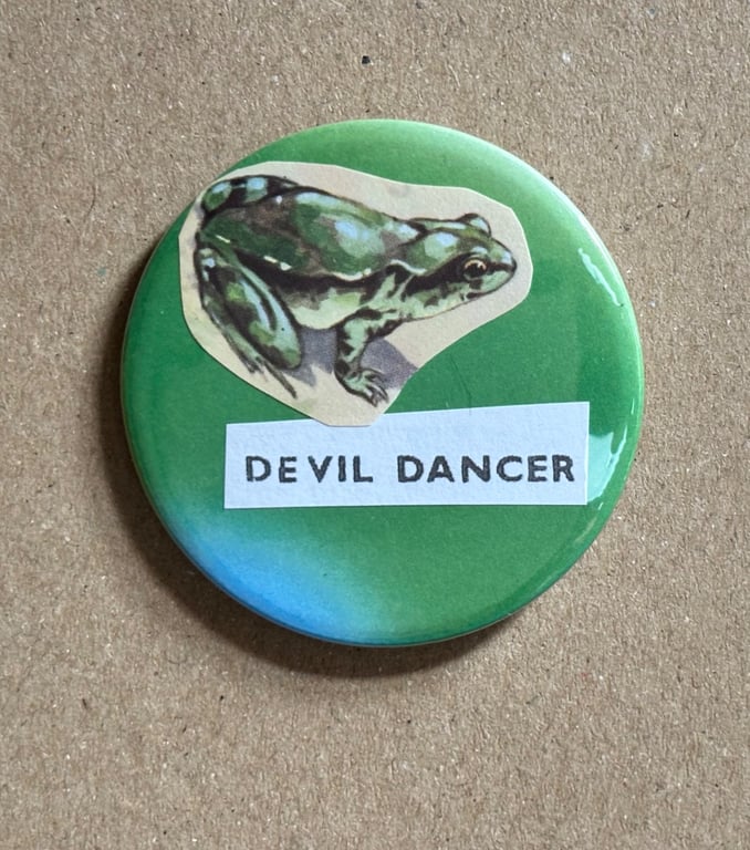 Collage pin badge - vintage book images & text - devil dancer
