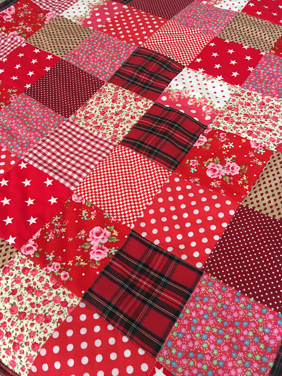 Patchwork quilt in Red cotton fabrics 