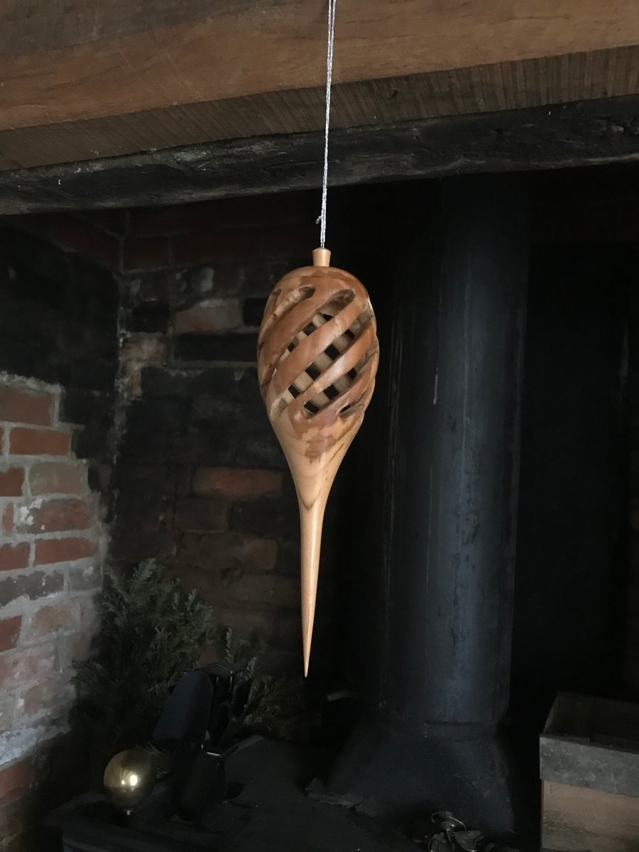 Hand turned, hollow, pierced hanging decoration