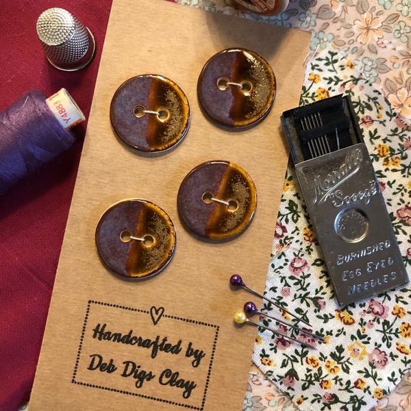 Set of 4 handcrafted ceramic buttons in smoky purple and amber