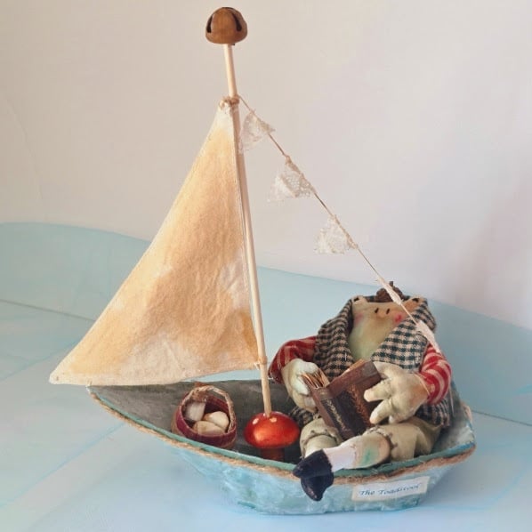 Handmade toad in a boat