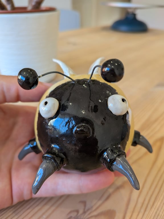 Concerned looking ceramic bee - Linda