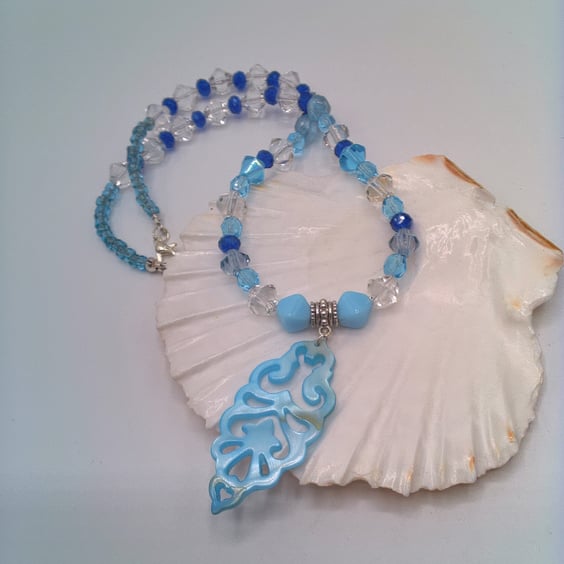 Necklace with Blue and Clear Bicone Beads and a Shell Pendant, Blue Pendant