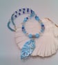 Necklace with Blue and Clear Bicone Beads and a Shell Pendant, Blue Pendant - Image 1