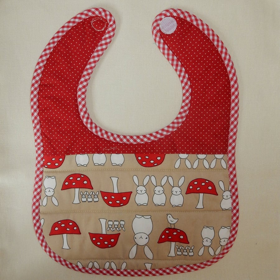 Baby bib, rabbits birds and toadstools