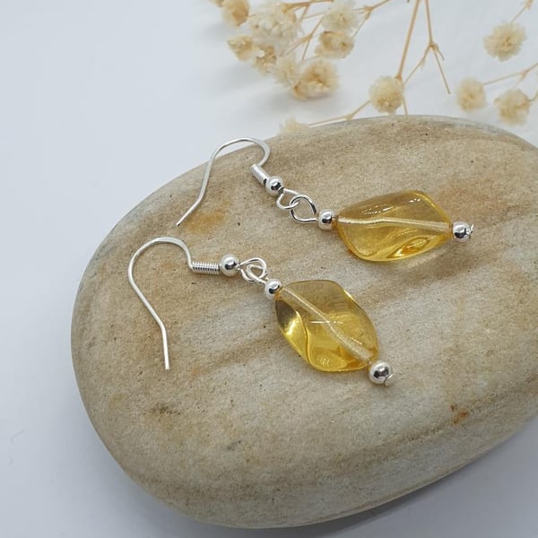silver plated earrings with lemon yellow faceted glass bead 