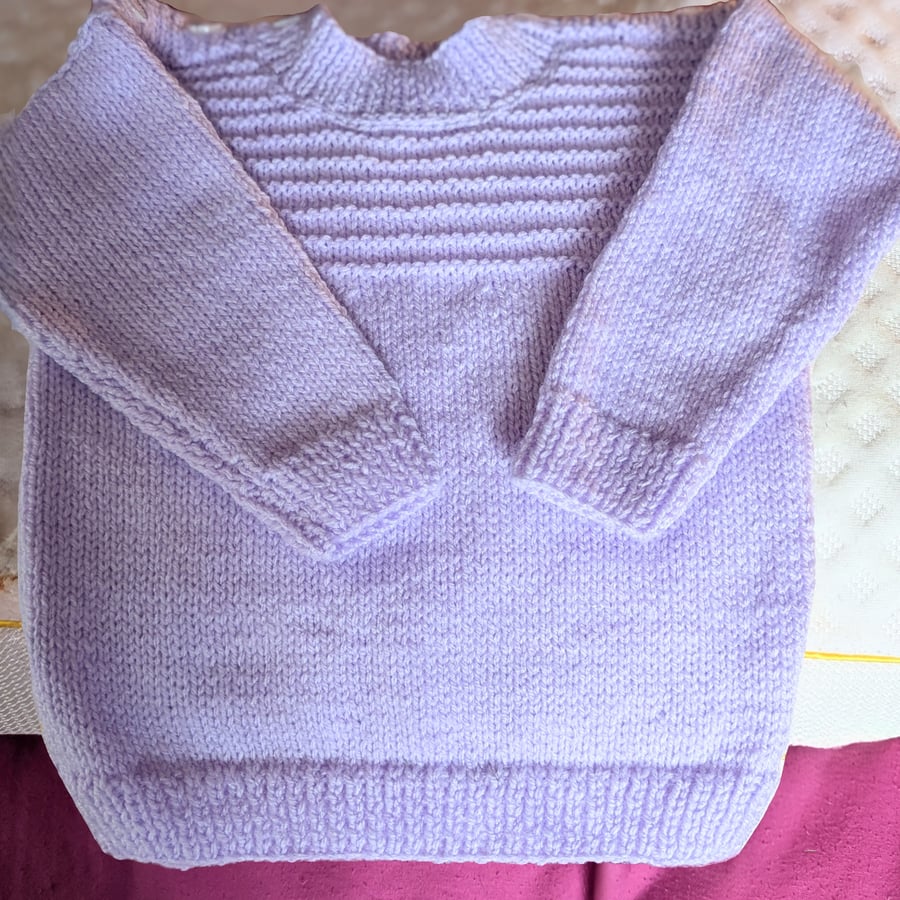 Delicate shade of lavender. Tabard style, the back is longer than the front. 