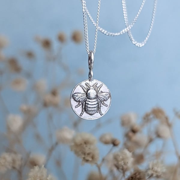 Tiny round Sterling Silver bumblebee charm in gift box, with polishing cloth.