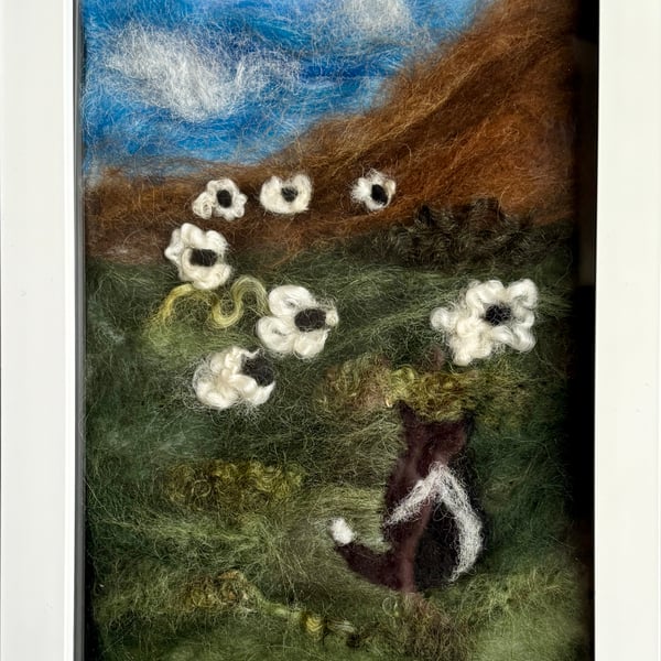 Needle felted scene of a sheep dog guarding the sheep 