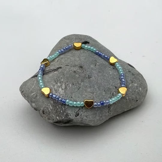 Beaded bracelet stackable blue beads with gold charms 