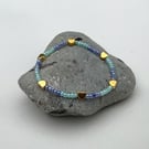 Beaded bracelet stackable blue beads with gold charms 
