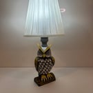 A hand painted and sealed owl lamp by Andrew Jenkins 