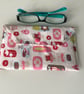 Fabric glasses case holder with popper fastener and padding for protection.
