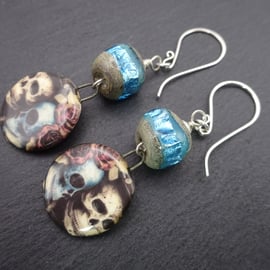 blue sparkly lampwork glass skull earrings