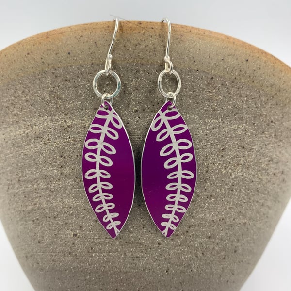 Bright pink aluminium fern earrings.
