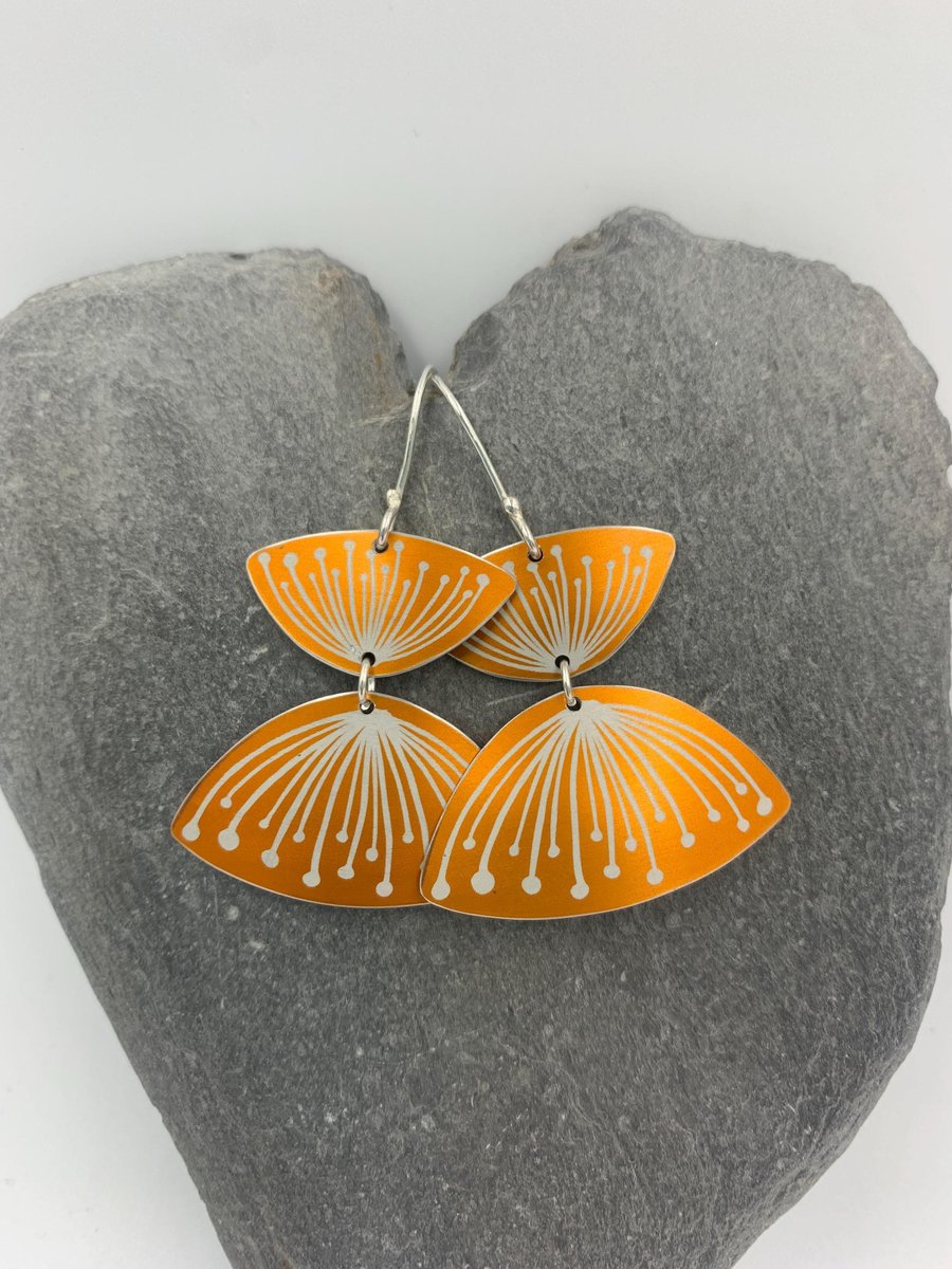 Orange seed head aluminium earrings
