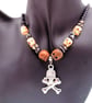 Skull & Crossbones Pendant on a Purple Bead and Skull Bead Necklace, Halloween - Image 2