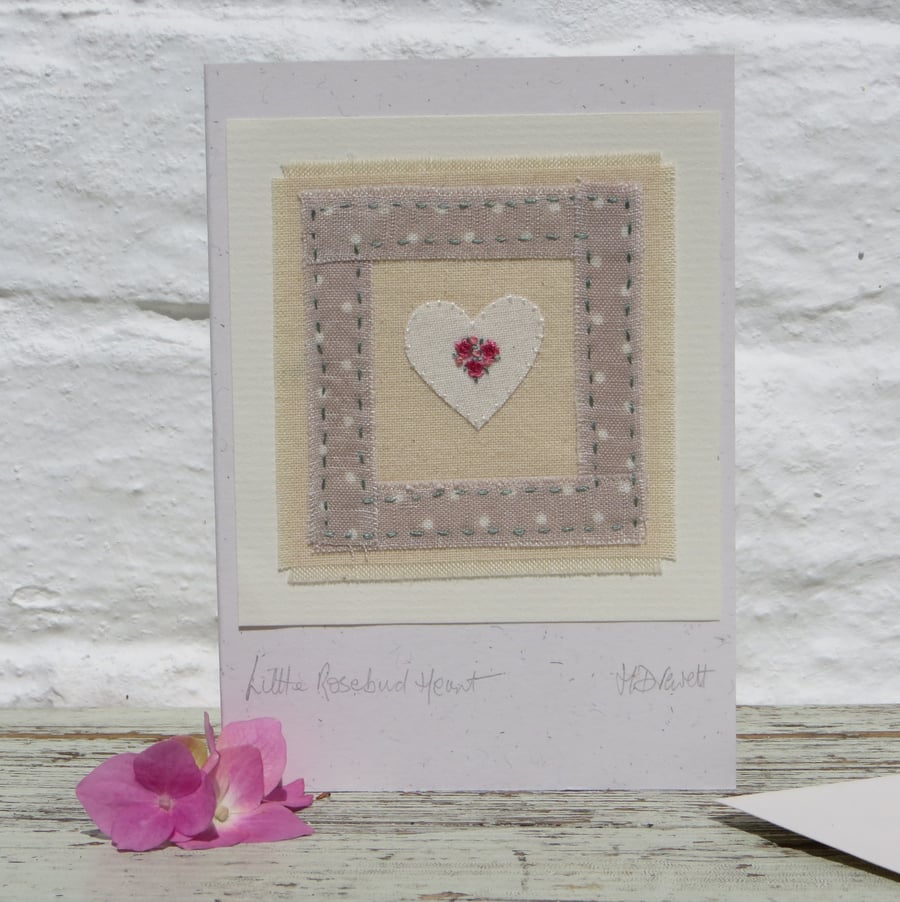 Hand-stitched miniature embroidery worked on heart mounted on greeting card