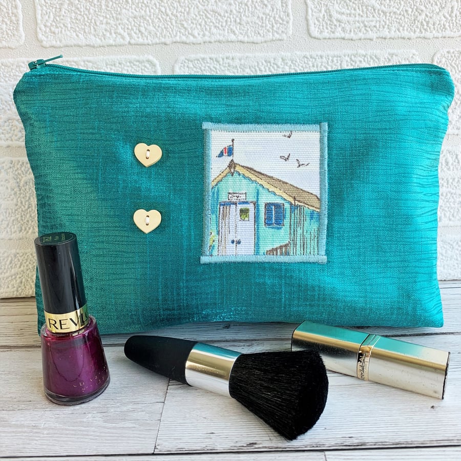 Large turquoise make up bag with beach hut decorative panel