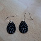 Tear drop earrings. White flowers on Black background