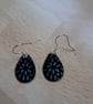 Tear drop earrings. White flowers on Black background