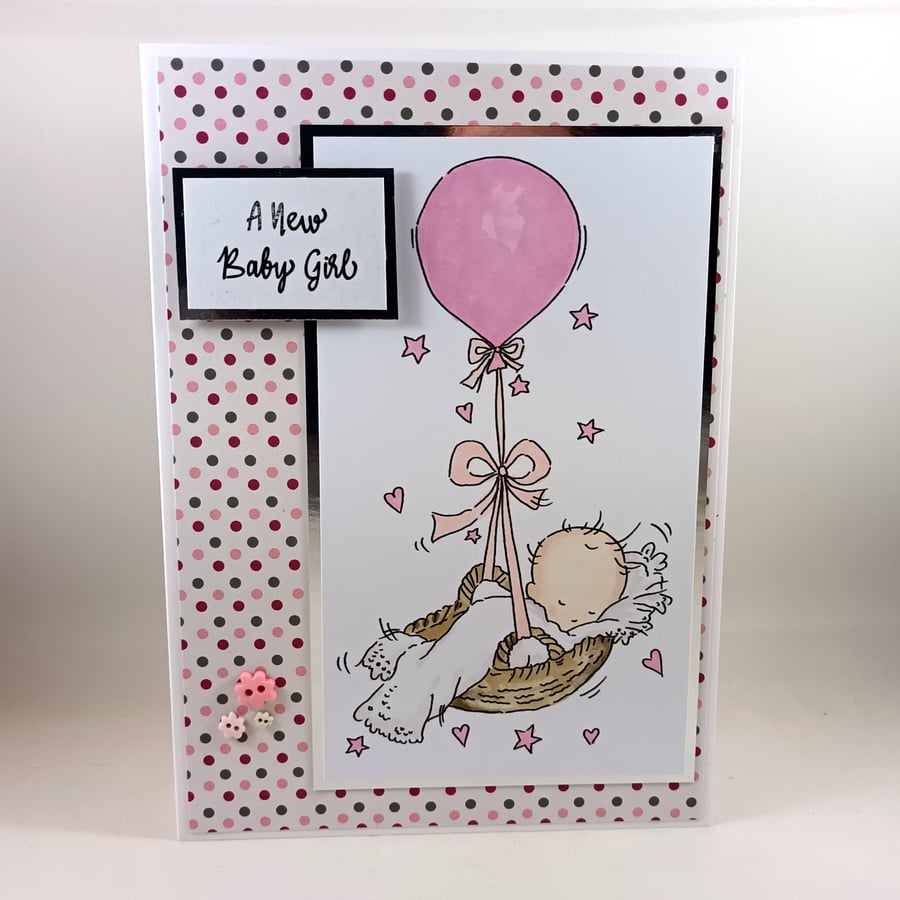 New baby girl card -  baby in balloon basket