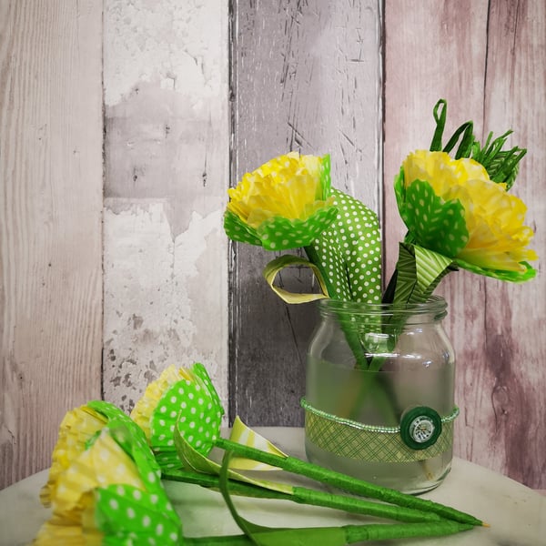 5 yellow and white polka dot paper flowers, in a decorated glass jam jar vase