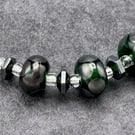 dark green and dark silver spotted lampwork glass necklace