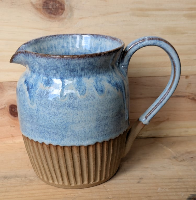 Larger pale blue carved jug (shoulder)