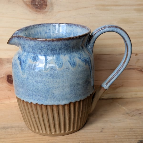 Larger pale blue carved jug (shoulder)