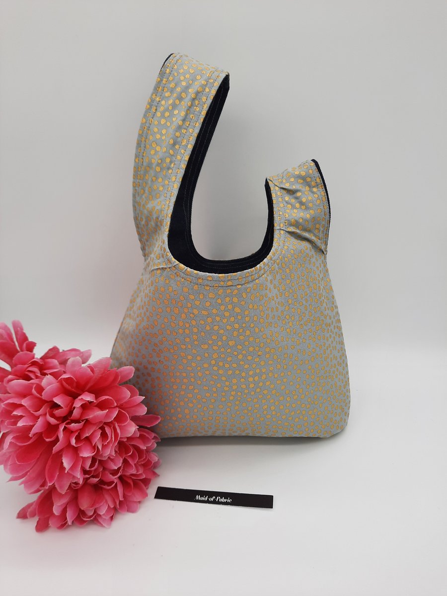 Knot bag, small,  reversible in denim and gold dot fabric.  