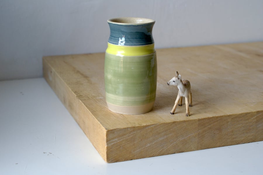 Studio pottery tube vase in green, yellow and blue
