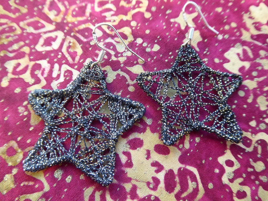 Black and gold star earrings