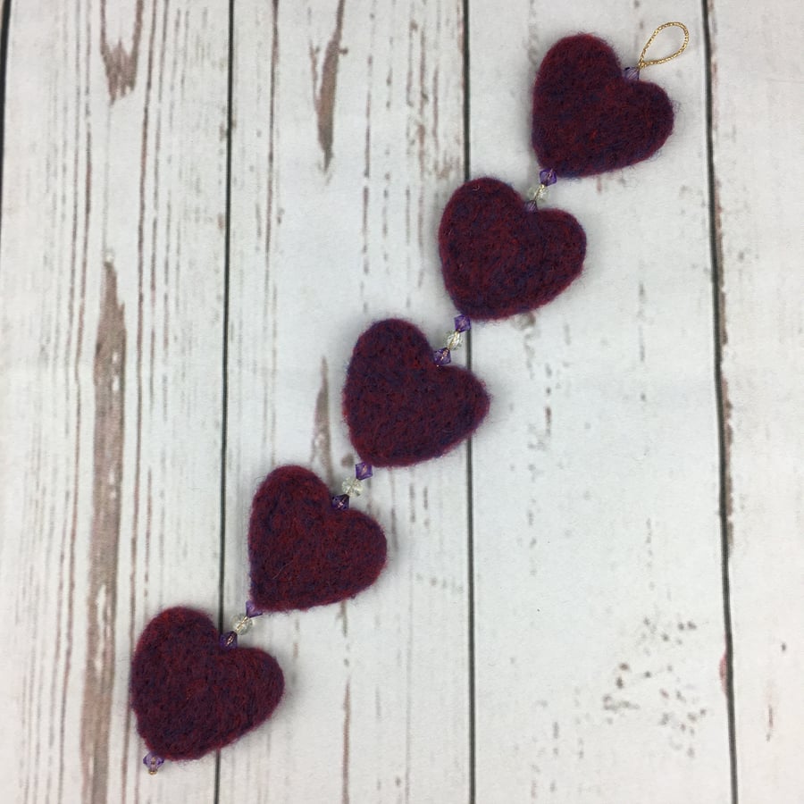 String of hearts, needle felted and beaded, purple