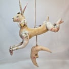 The hare jumped over the moon handmade soft sculpture hanging decoration.