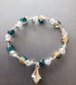 Elasticated bracelet with blue and clear beads and silver shell charm  - Image 3