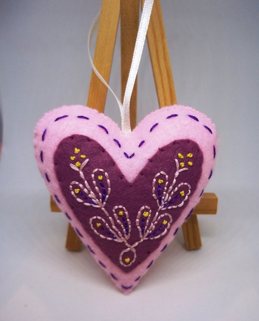 Pink embroidered folk art love heart. 