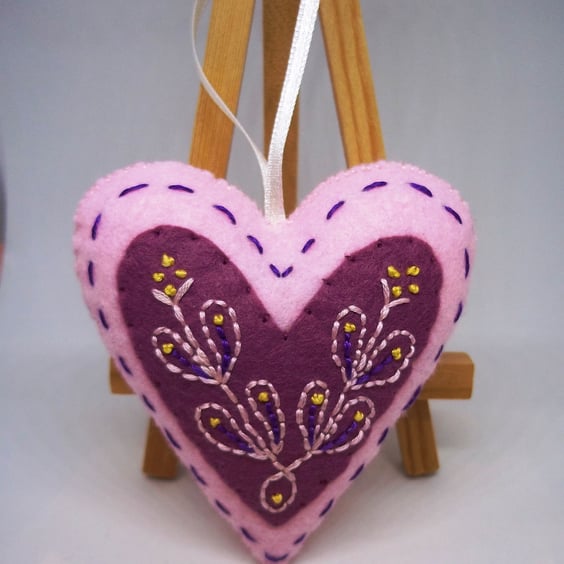 Pink embroidered folk art love heart. 