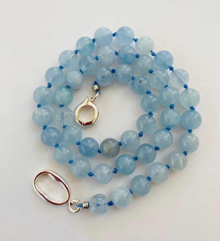 Aquamarine 8mm beads hand knotted and strung on silk 