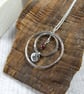 Circles Necklace. Recycled Sterling Silver Pebble with Carnation and Garnet - Image 4
