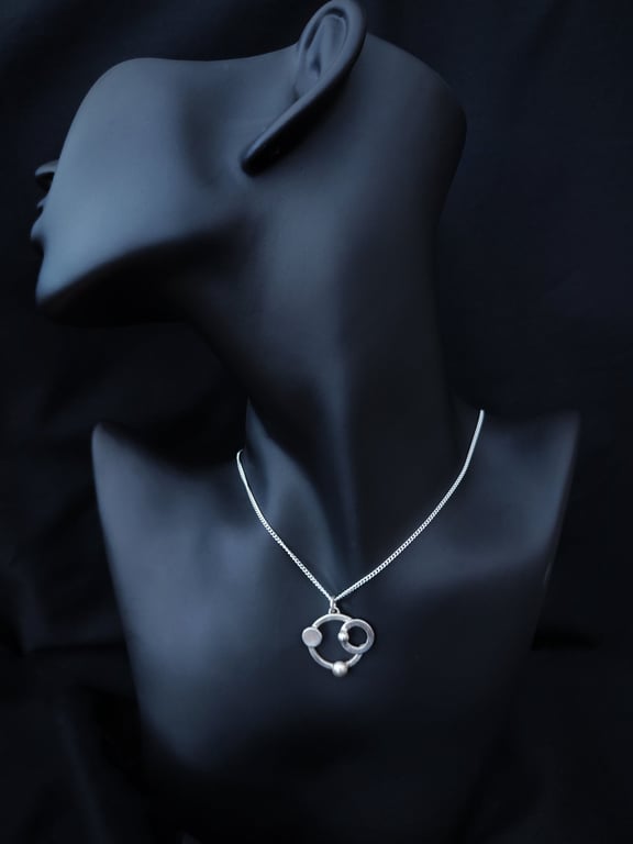 Futuristic silver pendant