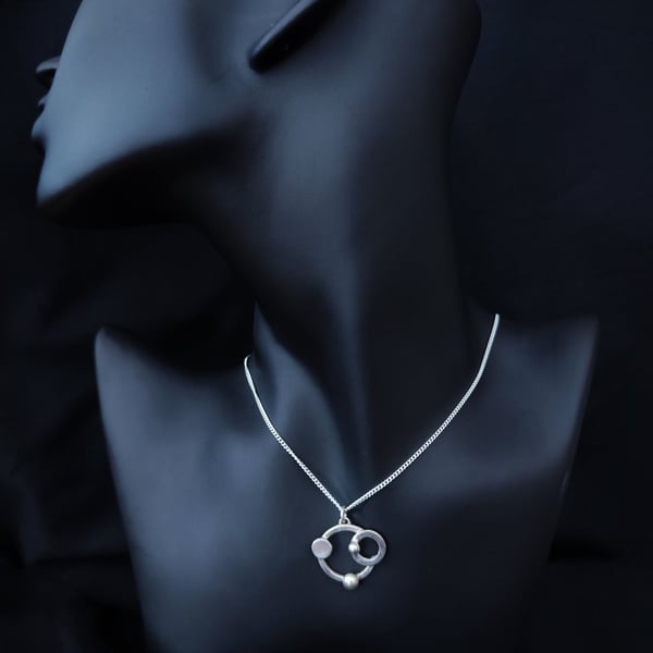 Futuristic silver pendant