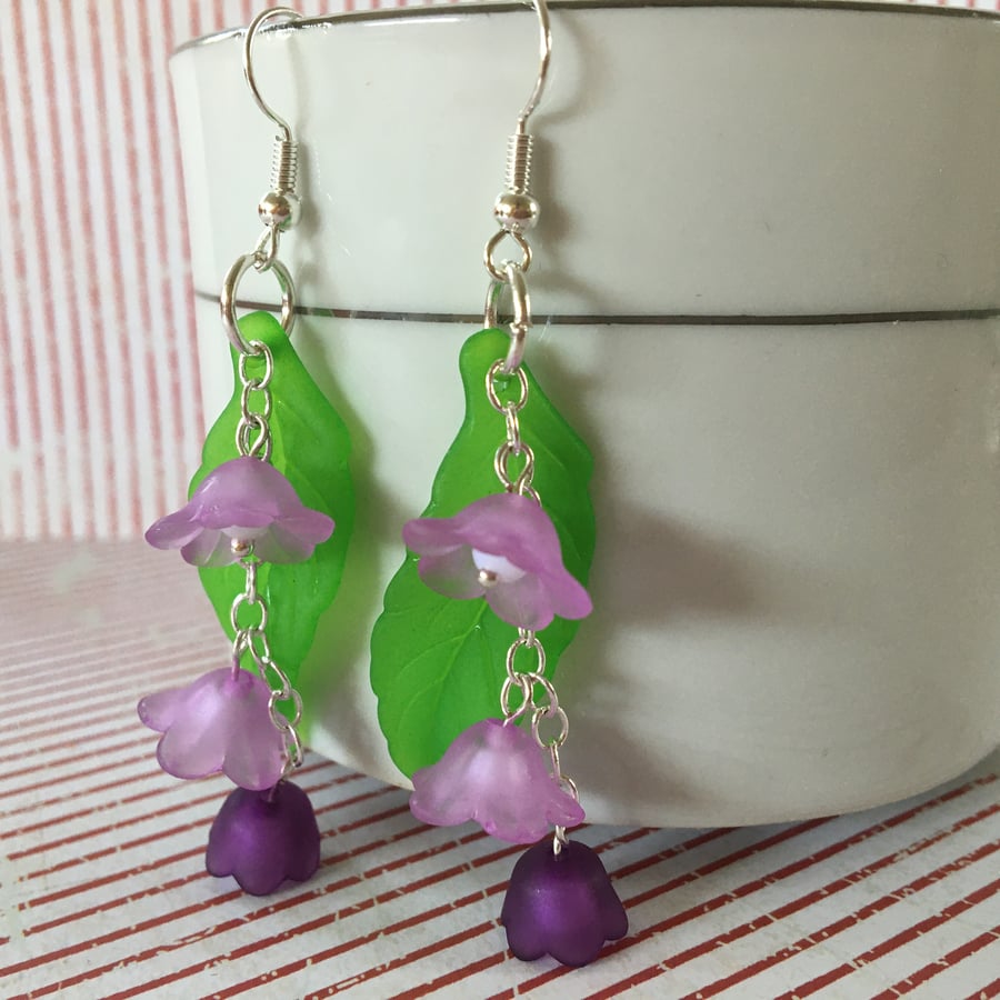 Green leaf on Lilac and purple flowers dangle earrings.