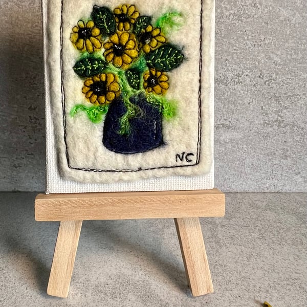 Mini sunflowers in vase