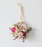 Mini handmade pink and white dried flower wreath hanging