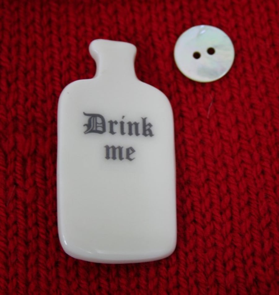 Small porcelain bottle brooch
