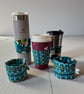 Reversible Cup Sleeve for Disposable and Travel Cups.